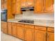 This kitchen showcases wooden cabinets, a gas stovetop, and ample countertop space at 2811 Bay Leaf Se Dr, Conyers, GA 30094