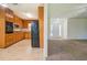 Bright kitchen with wooden cabinets open to the living room, offering an open-concept feel at 2811 Bay Leaf Se Dr, Conyers, GA 30094