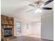 The living room offers neutral carpet, fireplace, ceiling fan, and view to the dining area at 2811 Bay Leaf Se Dr, Conyers, GA 30094