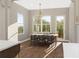Charming dining room with elegant chandelier and views of the outdoor landscape at 6206 Cedarcrest Nw Rd, Acworth, GA 30101
