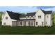 Back of the house featuring a long, covered porch with wood pillars and a dark roof at 6206 Cedarcrest Nw Rd, Acworth, GA 30101