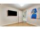 Cozy secondary bedroom featuring a large wall mounted television at 700 Park Regency Ne Pl # 603, Atlanta, GA 30326