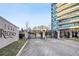 Gated entrance to Park Regency with modern high-rise in the background at 700 Park Regency Ne Pl # 603, Atlanta, GA 30326