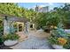 Beautiful garden with stone pergola and lush landscaping at 700 Park Regency Ne Pl # 603, Atlanta, GA 30326