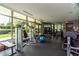 Well-equipped gym with fitness machines, weights, and large windows with a green view at 700 Park Regency Ne Pl # 603, Atlanta, GA 30326