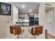 Modern kitchen with sleek countertops, a breakfast bar and stainless steel appliances at 700 Park Regency Ne Pl # 603, Atlanta, GA 30326