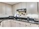 Modern kitchen featuring stainless steel appliances, dark countertops, and plenty of cabinet space at 700 Park Regency Ne Pl # 603, Atlanta, GA 30326