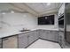 Cozy kitchenette with modern cabinets, stainless steel appliances, and tiled flooring at 700 Park Regency Ne Pl # 603, Atlanta, GA 30326