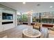 Modern living room with seating area, media center and floor to ceiling windows at 700 Park Regency Ne Pl # 603, Atlanta, GA 30326