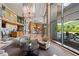 Grand lobby with chandelier, marble floors, and views of the landscaped grounds at 700 Park Regency Ne Pl # 603, Atlanta, GA 30326