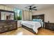 Stately primary bedroom featuring a large dresser, ceiling fan and view at 700 Park Regency Ne Pl # 603, Atlanta, GA 30326
