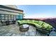 Inviting outdoor seating area with city views on a cozy wraparound couch with pillows at 700 Park Regency Ne Pl # 603, Atlanta, GA 30326
