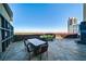 Large outdoor patio with comfortable seating and city views and fireplace at 700 Park Regency Ne Pl # 603, Atlanta, GA 30326
