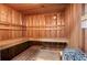 Warm wood sauna room with wooden benches and rocks and heat element for heating at 700 Park Regency Ne Pl # 603, Atlanta, GA 30326