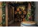 Charming wine cellar entrance with stacked barrels and decorative grape vines at 700 Park Regency Ne Pl # 603, Atlanta, GA 30326