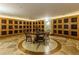 Elegant wine room featuring custom display shelves and a round tasting table at 700 Park Regency Ne Pl # 603, Atlanta, GA 30326