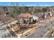 Aerial view of a beautifully landscaped home showcasing mature trees, a brick facade, and a manicured lawn at 3735 Holiday Lane Ln, Atlanta, GA 30349