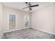 Bedroom featuring neutral carpet, two windows with wood blinds and ceiling fan at 3735 Holiday Lane Ln, Atlanta, GA 30349