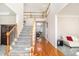 Bright foyer with hardwood floors, staircase, and open view to the living spaces at 3735 Holiday Lane Ln, Atlanta, GA 30349