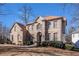 Stunning two-story brick home with a manicured front yard and arched entryway at 3735 Holiday Lane Ln, Atlanta, GA 30349