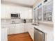 Bright kitchen with white cabinets, stainless steel appliances, and quartz countertops at 3735 Holiday Lane Ln, Atlanta, GA 30349
