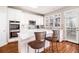 Modern kitchen featuring white cabinets, stainless appliances and a bright breakfast bar at 3735 Holiday Lane Ln, Atlanta, GA 30349