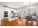 Bright eat-in kitchen with stainless appliances, white cabinets and hardwood floors at 3735 Holiday Lane Ln, Atlanta, GA 30349