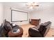 Entertainment room features a large screen, comfortable leather chairs and an entertainment center at 3735 Holiday Lane Ln, Atlanta, GA 30349