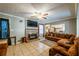 Spacious living room featuring tile floors and a cozy fireplace with a view to the kitchen at 600 Green Mountain Trl, College Park, GA 30349