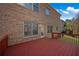 Exterior view of the brick facade, deck, window, and walkout access at 1502 Park Hollow Ln, Lawrenceville, GA 30043