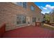 Exterior view of the brick facade, deck, window, and walkout access at 1502 Park Hollow Ln, Lawrenceville, GA 30043