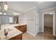 Bright bathroom featuring tile flooring, double sinks, and large mirror at 1502 Park Hollow Ln, Lawrenceville, GA 30043