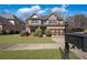 Charming two-story brick home with well-manicured landscaping and a two-car garage at 1502 Park Hollow Ln, Lawrenceville, GA 30043