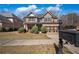 Charming two-story brick home with well-manicured landscaping and a two-car garage at 1502 Park Hollow Ln, Lawrenceville, GA 30043