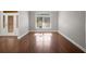 Bright living room showcasing stained-glass entry and a view from the front window at 1502 Park Hollow Ln, Lawrenceville, GA 30043