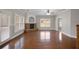 Inviting living room with a classic fireplace, hardwood flooring, and natural light streaming through large windows at 1502 Park Hollow Ln, Lawrenceville, GA 30043