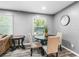 Cozy dining area with a round table, upholstered chairs, and a window view, ideal for casual meals at 2150 Meadowlane Dr, Atlanta, GA 30311