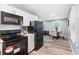 Bright kitchen with modern appliances, white cabinets, and seamless flow to the dining area at 2150 Meadowlane Dr, Atlanta, GA 30311