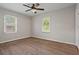 Neutral bedroom featuring updated ceiling fan and hardwood floors at 2478 Graywall St, Atlanta, GA 30344