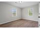 A bedroom featuring hardwood floors, neutral paint and natural light from multiple windows at 2478 Graywall St, Atlanta, GA 30344