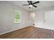 A bright bedroom featuring hardwood floors, ceiling fan, ensuite bathroom and natural light at 2478 Graywall St, Atlanta, GA 30344