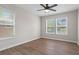 A bright bedroom featuring hardwood floors, ceiling fan and natural light from windows at 2478 Graywall St, Atlanta, GA 30344