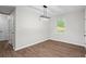 A dining room featuring hardwood floors, modern chandelier and bright light from window at 2478 Graywall St, Atlanta, GA 30344
