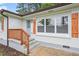 Close-up view of the house entrance, featuring a charming front porch and freshly painted exterior at 2478 Graywall St, Atlanta, GA 30344