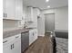 The kitchen features a stainless steel dishwasher, granite countertops, and modern white cabinetry at 2478 Graywall St, Atlanta, GA 30344