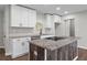 Modern kitchen featuring sleek white cabinets, stainless steel appliances, and stylish granite countertops at 2478 Graywall St, Atlanta, GA 30344