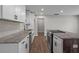 Bright kitchen featuring granite countertops, stainless appliances, and white cabinets at 2478 Graywall St, Atlanta, GA 30344