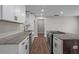 Galley kitchen featuring stainless steel appliances and a spacious island with dark wood accents at 2478 Graywall St, Atlanta, GA 30344