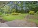 Expansive backyard featuring lush greenery and mature trees, offering privacy and a serene outdoor space at 2478 Graywall St, East Point, GA 30344