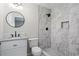 Bathroom with a walk-in shower and a white vanity sink at 2478 Graywall St, East Point, GA 30344